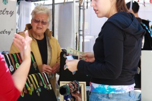 woman buying jewelry at Baldwin Park Arts Fest